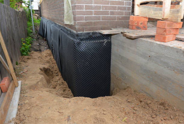 Happy homeowners after waterproofing job in Newberry